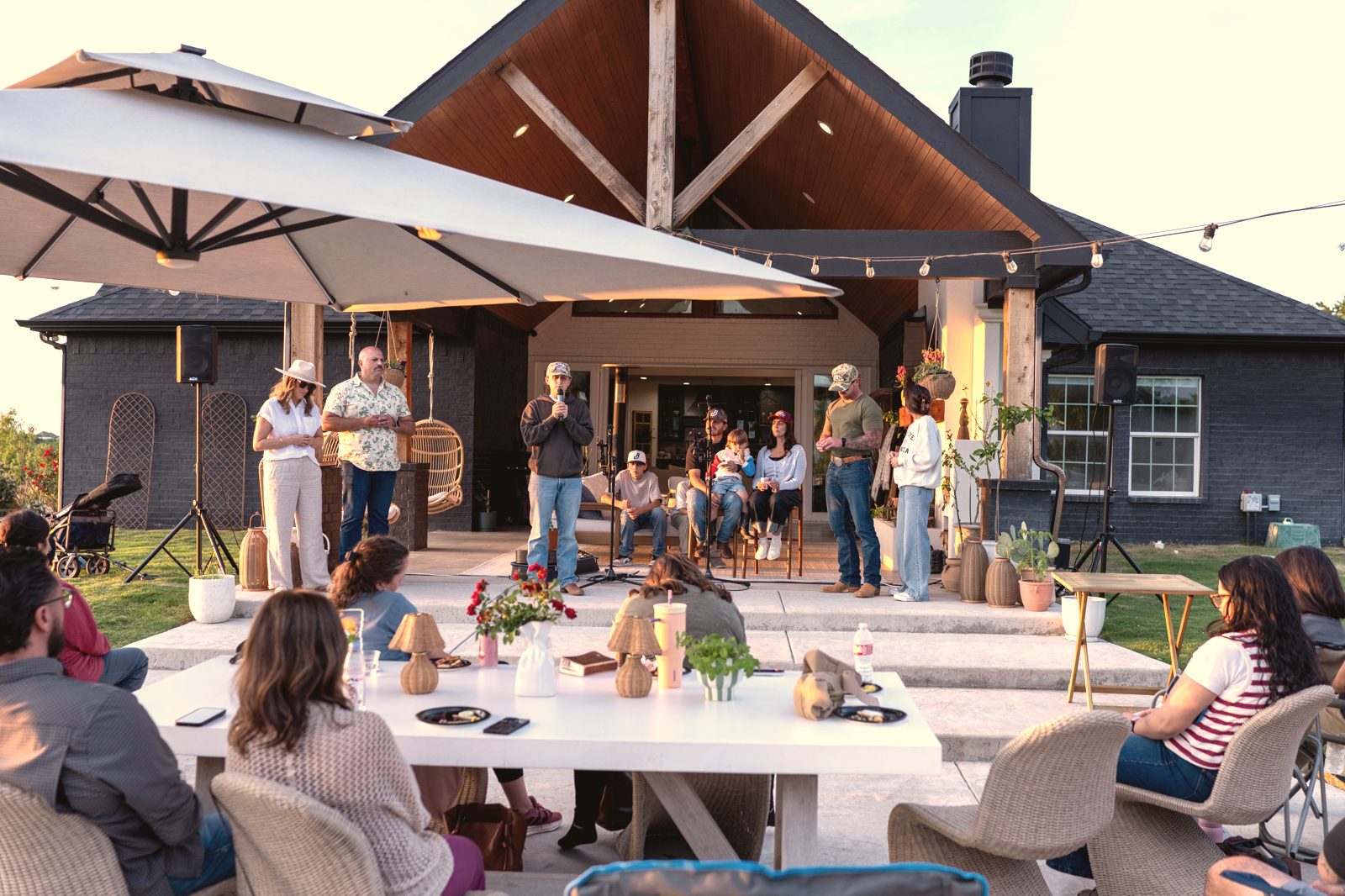 A Tend Gathering on the patio of a home, with a communion table set in front