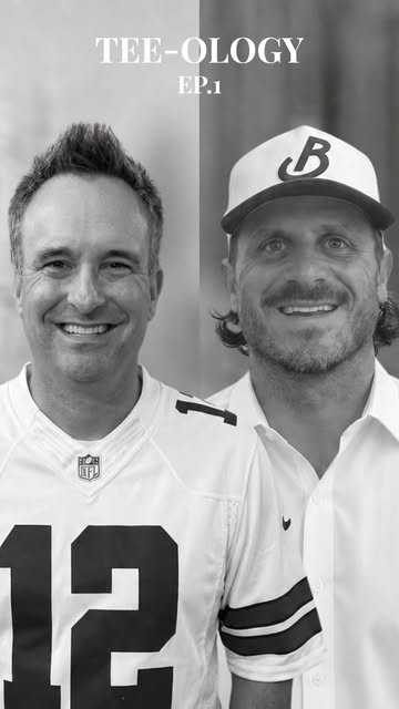 Two friends in golf caps smiling together